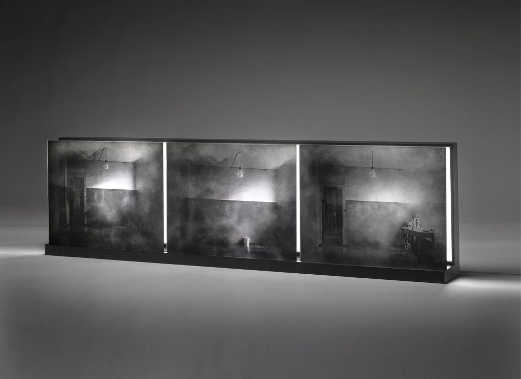 Three moments. Emulsion on glass, light, lacquered wood. 52 x 150 x 17 cm