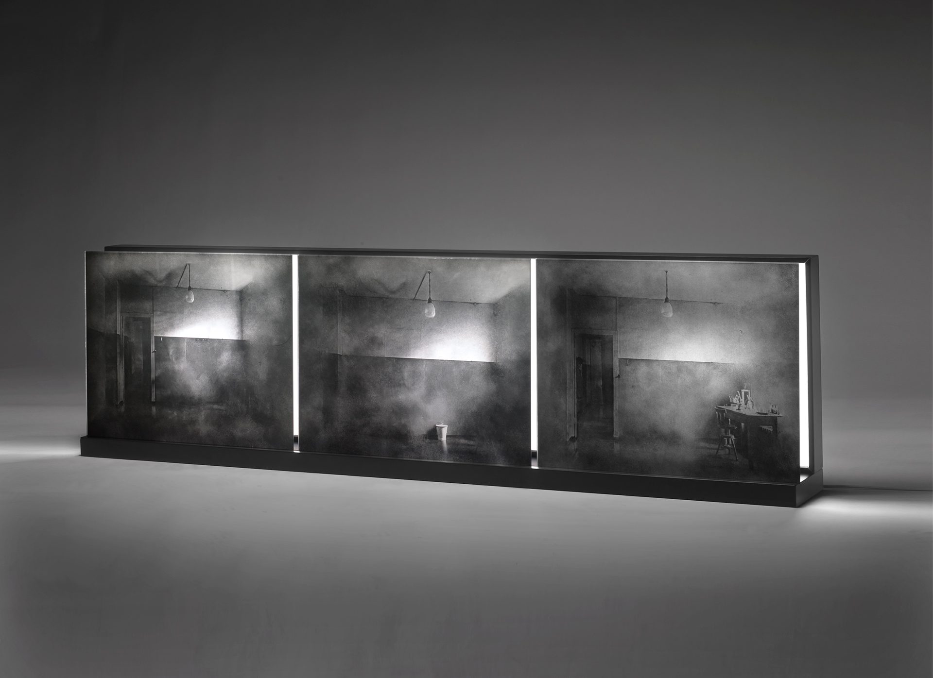 Three-moments.-52-x-150-x-17cm.-Emulsion-on-glass,-light,-lacquered-wood