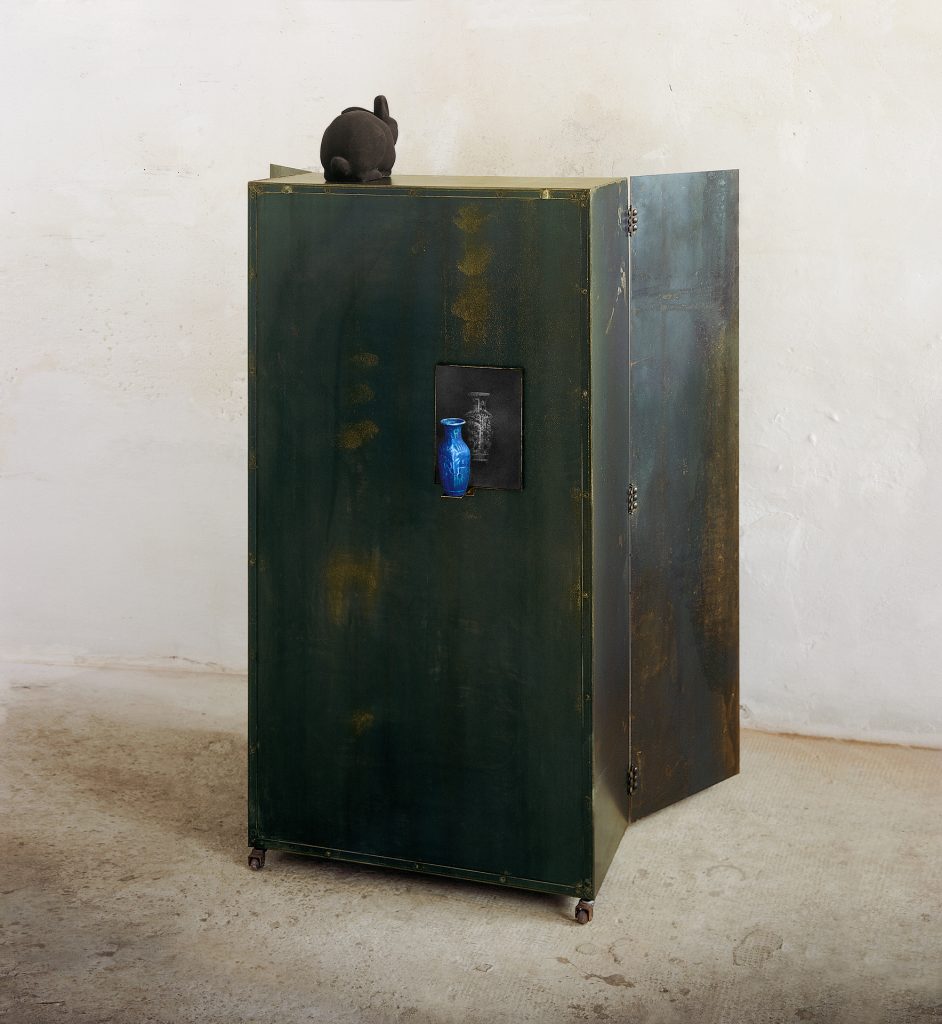Untitled with a white dress (back-side). Iron, hand-made paper, pigment, glass, photo. 175 x 90 x 40 cm
