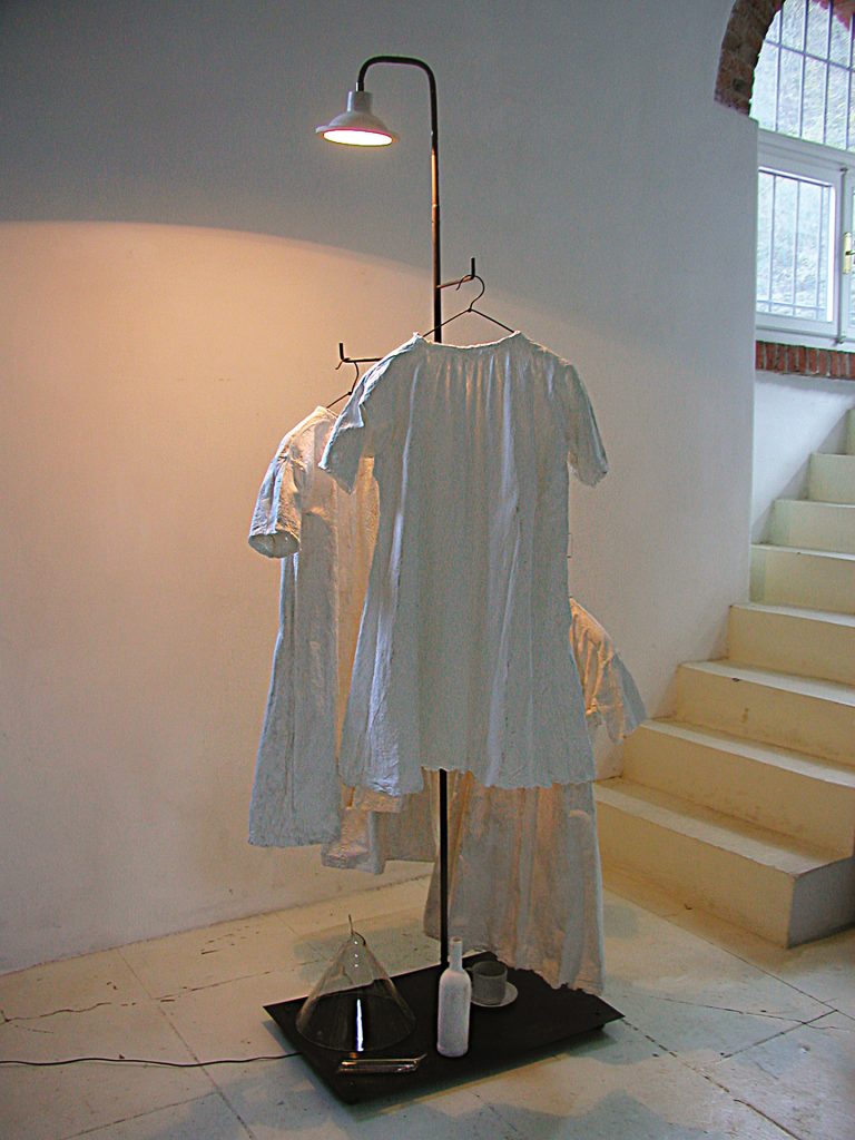 Vestiti bianchi. Hand made paper, iron, light, glass, pigment. 232 x 80 x 78 cm