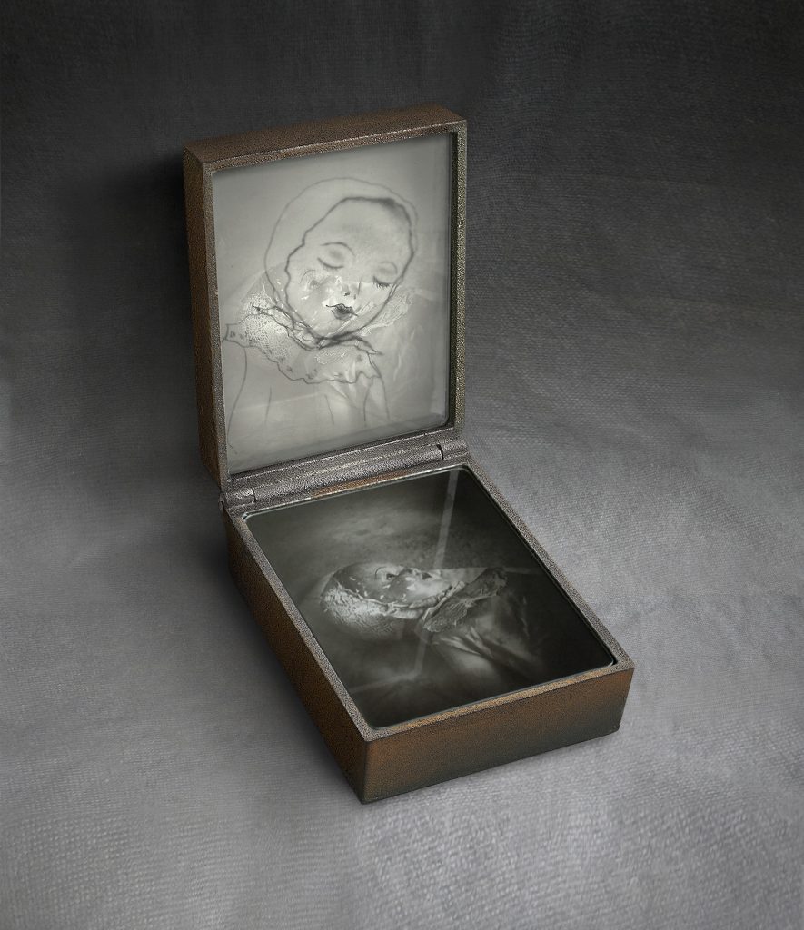 Bambola. Cast iron, drawing, glass. 30 x 20 x 28 cm