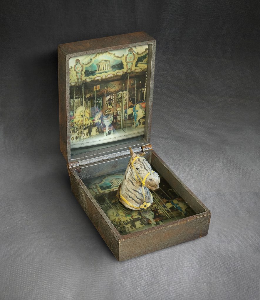 Carousel. Cast iron, image on glass, hand-made paper, pigment. 30 x 20 x 28 cm