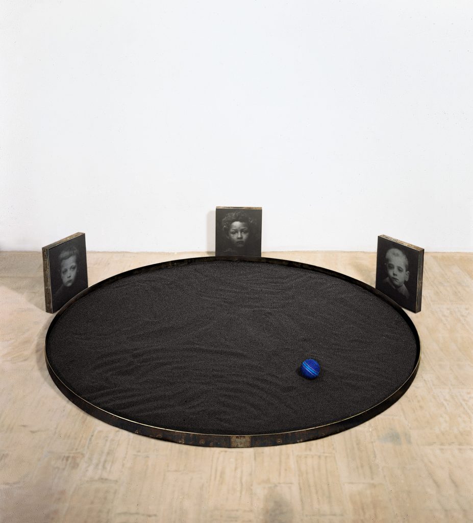 In black. Iron, black sand, hand-made paper, photo. Collection of Stadtische Galerie (Wurzburg, Germany)
