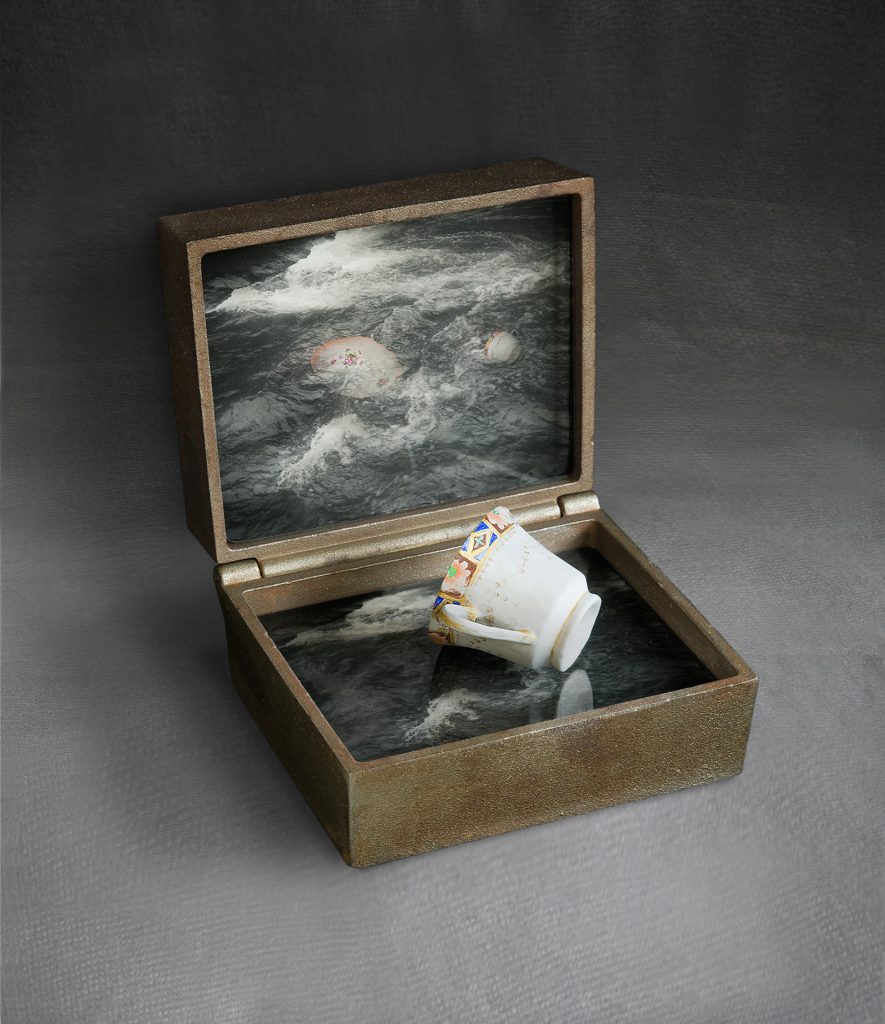 The-river  Cast iron, image on glass, hand-made paper, pigment. 28 x 25 x 22 cm