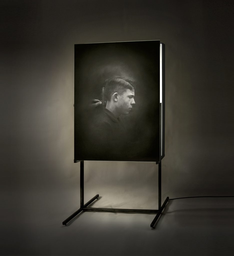 Untitled (boy), profile. Emulsion on glass, light, iron. 225 x 110 x 60 cm