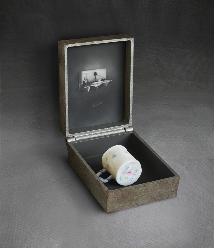White-cup Cast iron, image on glass, hand-made paper, pigment. 30 x 20 x 28 cm
